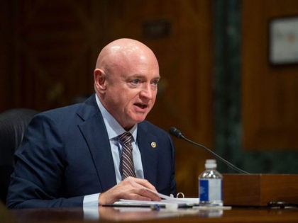 US Senator Mark Kelly, Democrat of Arizona, speaks during the Senate Finance Committee hearing on the nomination of Chris Magnus to be the next US Customs and Border Protection Commissioner, on Capitol Hill in Washington, DC, October 19, 2021. (Photo by Rod LAMKEY / POOL / AFP) (Photo by ROD …