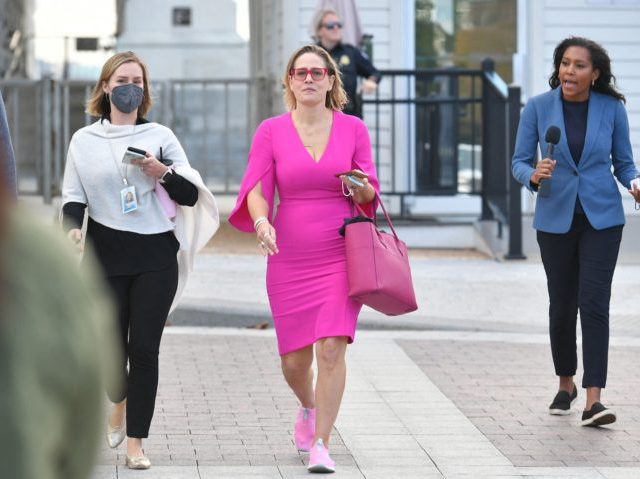 Senator Kyrsten Sinema (C), D-AZ, departs from the US Capitol in Washington, DC, on October 28, 2021. - US President Joe Biden announced a "historic" framework Thursday for spending $3 trillion on America's social safety net and crumbling infrastructure, but his claim to be on the cusp of a major …