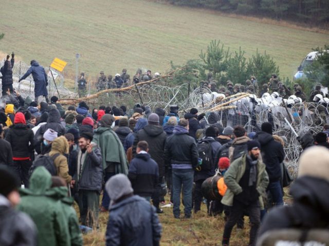 TOPSHOT - A picture taken on November 8, 2021 shows migrants at the Belarusian-Polish bord