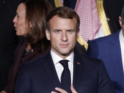 France's President Emmanuel Macron (C) flanked by Libya's interim leaders Mohamed El-Menfi