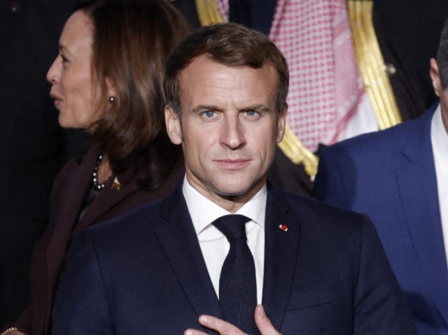 France's President Emmanuel Macron (C) flanked by Libya's interim leaders Mohamed El-Menfi (L) and Abdul Hamid Dbeibah (R) pose for a family picture as they attend the International conference on Libya at the Maison de la Chimie in Paris on November 12, 2021. (Photo by Yoan VALAT / POOL / …