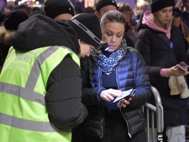 People have their Covid vaccination certificates checked at the entrance of the Avicii Arena before the "Together For A Better Day" concert in Stockholm on December 1, 2021 the first day of mandatory covid passes for certain events in Sweden. - - Sweden OUT (Photo by Anders WIKLUND / TT …