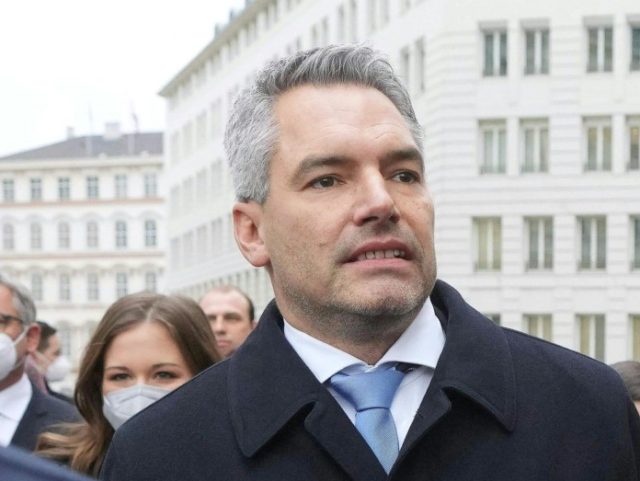 Austria's designated Chancellor Karl Nehammer (2nd R) and Austria's outgoing Chancellor Alexander Schallenberg (R) arrive for an official ceremony at the presidential Hofburg Palace in Vienna on December 6, 2021. - Austria's Interior Minister Karl Nehammer is due to be sworn in as the country's third chancellor in as many …