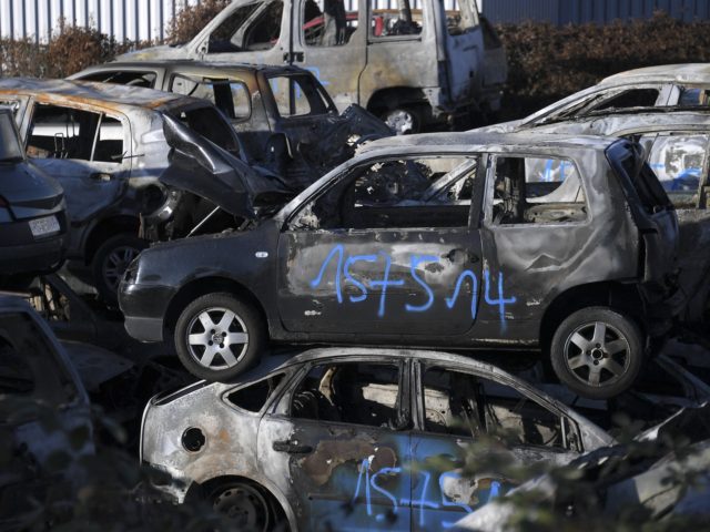 A picture taken on January 1, 2022 in a car breakers yard of Strasbourg shows burnt-out cars collected by city employees after the New Year's eve in the eastern French city of Strasbourg. (Photo by Frederick FLORIN / AFP) (Photo by FREDERICK FLORIN/AFP via Getty Images)