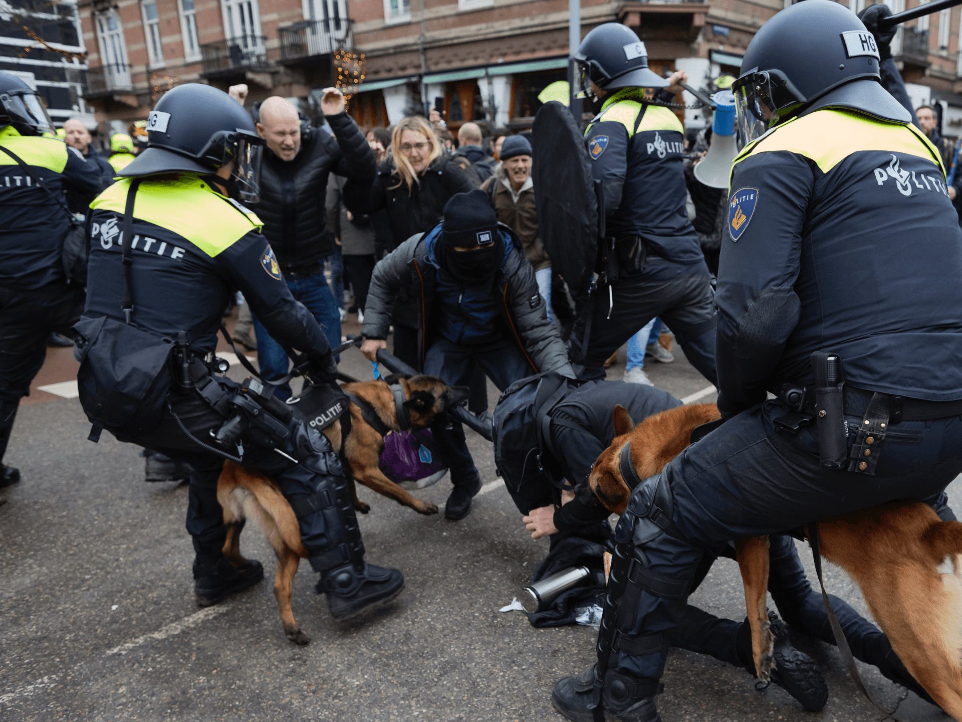 AMSTERDAM, NETHERLANDS - JANUARY 02: Clashes erupt between police anti-riot officers and antivaxxers affiliated to far-right parties near Museumplein on January 2, 2022 in Amsterdam, Netherlands. With riot police expected to be on strike, authorities hav banned the Covid-19 lockdown protest in the Dutch capital. The postponed police protest is part of a series of strikes by police union members to draw attention to police capacity problems and conditions of work. (Photo by Pierre Crom/Getty Images)