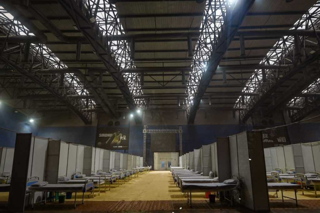 Medical beds are lined up inside a ward at the Commonwealth games (CWG) village sports complex that is temporarily converted into a Covid-19 coronavirus care center, in New Delhi on January 5, 2022. (Photo by Money SHARMA / AFP) (Photo by MONEY SHARMA/AFP via Getty Images)