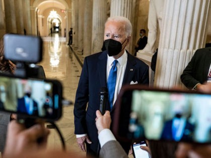 WASHINGTON, DC - JANUARY 06: President Joe Biden speaks to the media as he departs with Vice President Kamala Harris after they spoke at the U.S. Capitol on January 6, 2022 in Washington, DC. One year ago, supporters of President Donald Trump attacked the U.S. Capitol Building in an attempt …