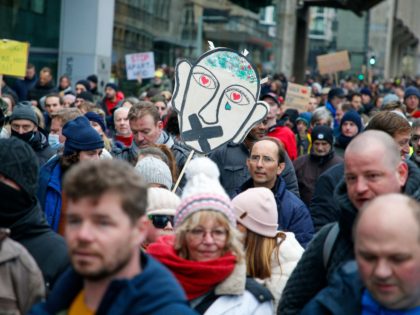 Some 5000 people take part in a demonstration to protest against the health pass and measures aimed at curbing the spread of the Covid-19 on January 9, 2022 in Brussels. - Belgium OUT (Photo by NICOLAS MAETERLINCK / Belga / AFP) / Belgium OUT (Photo by NICOLAS MAETERLINCK/Belga/AFP via Getty …