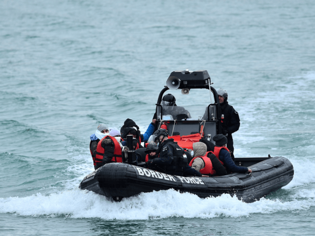 Migrants picked up at sea while attempting to cross the English Channel, are pictured on a