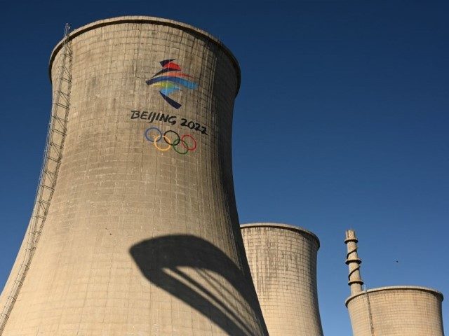 The Olympic logo is pictured painted on a factory chimney near the Olympics freestyle skiing and snowboard complex during a media technical visit at the Big Air Shougang on January 13, 2022, ahead of the Beijing Winter Olympic Games starting on February 4. (Photo by François-Xavier MARIT / AFP) (Photo …