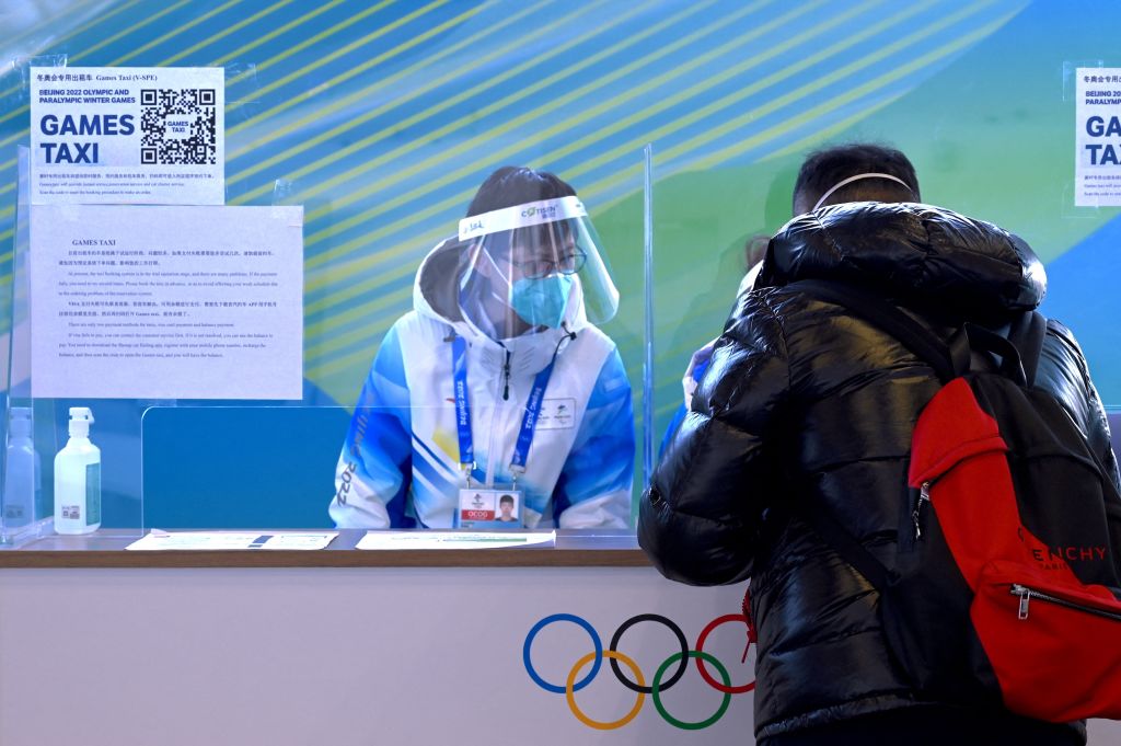 A man asks for transportation information at the MPC media centre help desk, inside the "bubble" in Beijing on January 13, 2022, ahead of the 2022 Beijing Winter Olympic Games. (Photo by François-Xavier MARIT / AFP) (Photo by FRANCOIS-XAVIER MARIT/AFP via Getty Images)