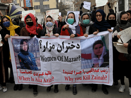 Afghan women march as they chant slogans and hold banners during a women's rights protest in Kabul on January 16, 2022. (Photo by Wakil KOHSAR / AFP) (Photo by WAKIL KOHSAR/AFP via Getty Images)