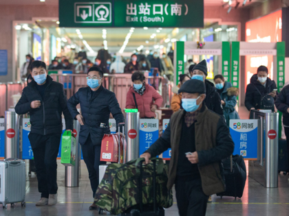 This photo taken on January 16, 2022 shows passengers arriving the Nanjing rail way station in Nanjing in China's eastern Jiangsu province, ahead of the Lunar New Year. - China OUT (Photo by AFP) / China OUT (Photo by STR/AFP via Getty Images)