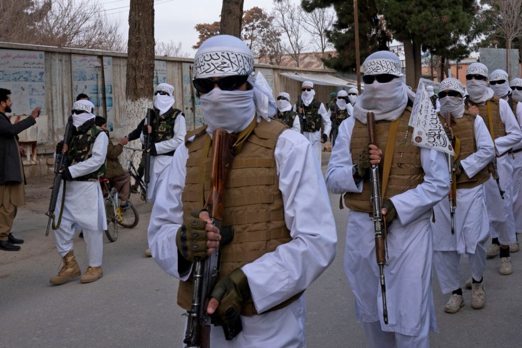 In this photograph taken on January 16, 2022, Taliban fighters take part in a military street parade in Maymana, capital of Faryab province. (Photo by Elise BLANCHARD / AFP) (Photo by ELISE BLANCHARD/AFP via Getty Images)