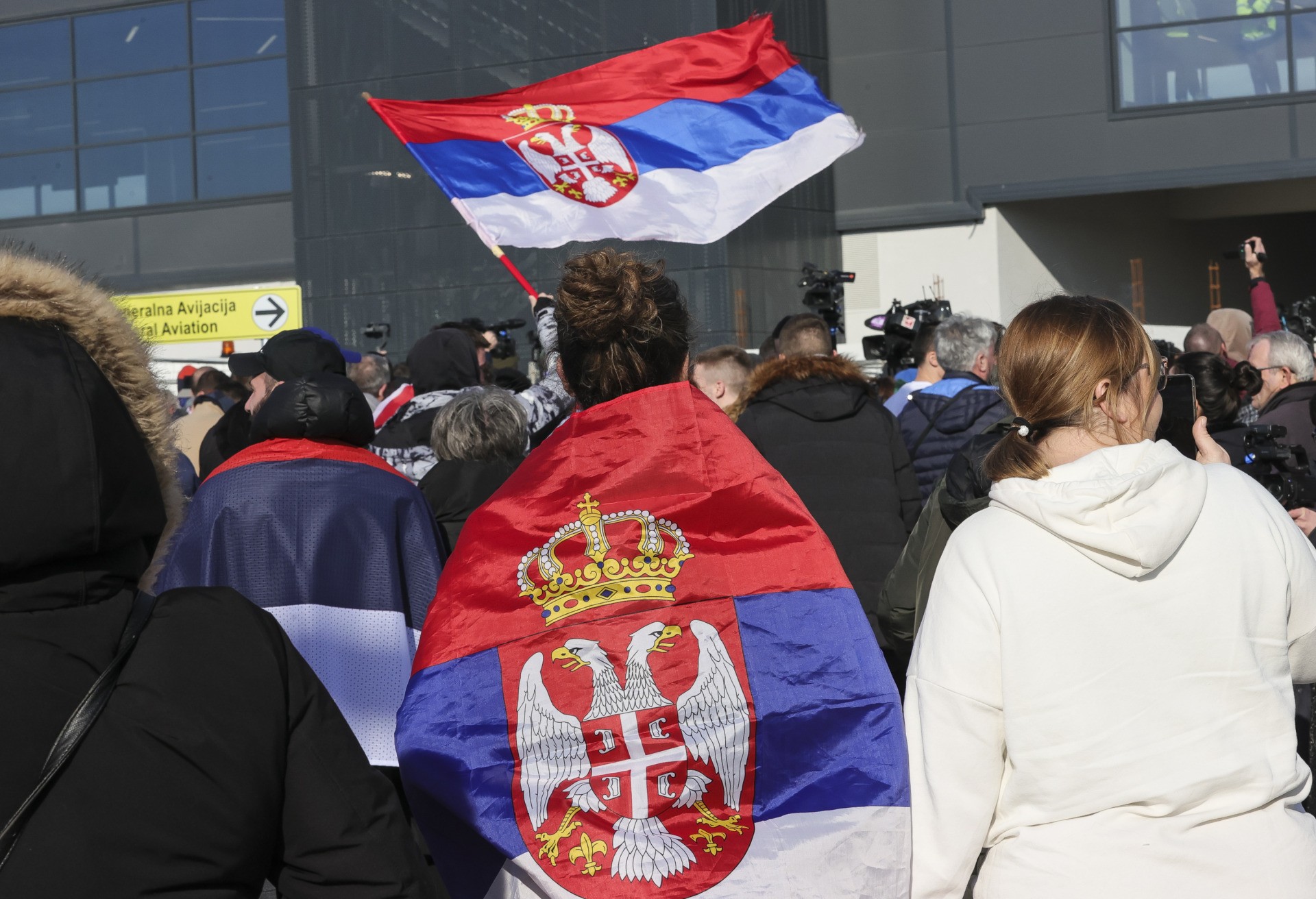 Supporters of Serbian tennis player Novak Djokovic gather at the Nikola Tesla Airport on January 17, 2022 in Belgrade, Serbia. (Photo by Srdjan Stevanovic/Getty Images)