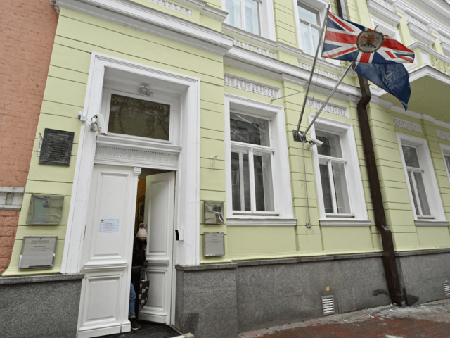 A woman comes out the UK Embassy building in Kyiev on January 24, 2022. - Britain's foreign ministry said on January 24, 2022 it was withdrawing some staff and their relatives from its embassy in Ukraine in response to the "growing threat from Russia". (Photo by Sergei Supinsky / AFP) …