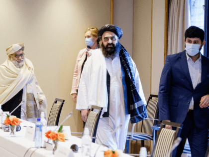 Taliban representatives Mutiul Haq Nabi Kheel (L) and Amir Khan Muttaqi (C) attend a meeting between Norwegian humanitarian organizations and representatives from the Taliban at the Soria Moria hotel in Oslo, Norway, on January 25, 2022, the last day of the hardline Islamists' controversial first visit to Europe since returning …