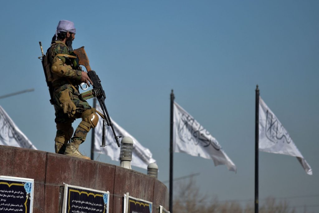 TOPSHOT - A Taliban fighter stands guard before to start a women protest in support of the Taliban regime at the Ahmad Shah Massoud square in front of the US embassy in Kabul on January 26, 2022. (Photo by Wakil KOHSAR / AFP) (Photo by WAKIL KOHSAR/AFP via Getty Images)