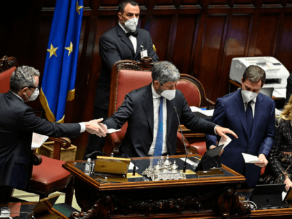 President of the Italian Chamber of Deputies, Roberto Fico (C) and ushers count votes during a third round of voting for Italy's new president on January 26, 2022 in Rome's parliament. - More than half of the almost 1,000 MPs, senators and regional representatives who voted left their papers blank …