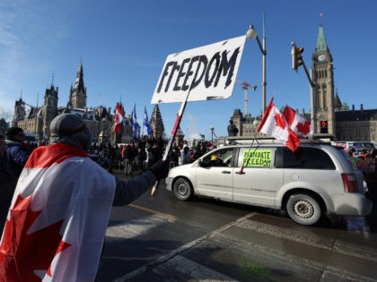 Supporters of the Freedom Convoy protest against Covid-19 vaccine mandates and restrictions in front of Parliament of Canada in January 28, 2022 in Ottawa, Canada. - A convoy of truckers started off from Vancouver on January 23, 2022 on its way to protest against the mandate in the capital city …