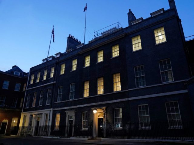 A light shines above the door of 10 Downing Street, the official residence of Britain's Prime Minister, in central London on January 31, 2022. - British Prime Minister Boris Johnson on Monday apologised after his government was criticised for "failures of leadership and judgment" in allowing lockdown-breaching parties at his …