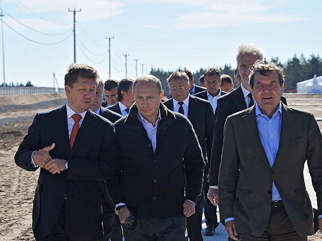Russian Prime Minister Vladimir Putin (C), Gazprom Chief Executive Officer Alexei Miller (L) and former German chancellor Gerhard Schroeder (R) arrive for the inauguration of the Nord Stream Project information mount at the gas compressor station "Portovaya" outside Vyborg, September 6, 2011. Vladimir Putin launched the Nord Stream pipeline, designed to bring Russian natural gas to Germany via the bed of the Baltic Sea and to avoid shipments through central Europe.  AFP PHOTO / RIA NOVOSTI / POOL / ALEXEY NIKOLSKY (Photo credit should read ALEXEY NIKOLSKY/AFP via Getty Images)
