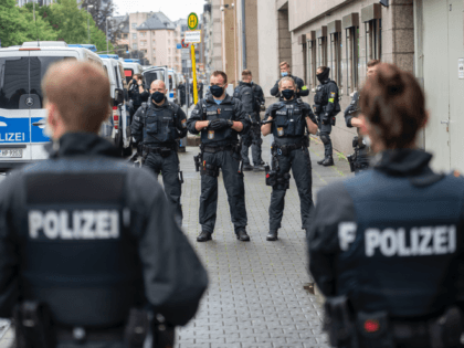 FRANKFURT AM MAIN, GERMANY - JUNE 16: Police officers wait for the departure of Stefan Ernst, who is accused of murdering politician Walter Luebcke, and Walter H. after the first day of the trial at the Oberlandgericht Frankfurt courthouse on June 16, 2020 in Frankfurt, Germany. Ernst, who has a …