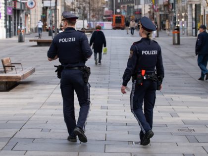 VIENNA, AUSTRIA - APRIL 01: Police officers patrol Kaertner Strasse shopping street as it stands empty and its shops closed on the first day of an Easter shutdown during the coronavirus pandemic on April 01, 2021 in Vienna, Austria. Authorities have declared the Easter period from April 1 to April …