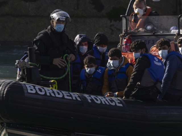 DOVER, ENGLAND - SEPTEMBER 09: Migrants are brought into Dover docks by Border Force staff