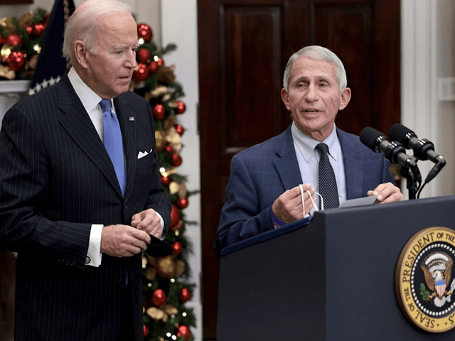 Anthony Fauci (R), Director of the National Institute of Allergy and Infectious Diseases and Chief Medical Advisor to the President, speaks alongside U.S. President Joe Biden as he delivers remarks on the Omicron COVID-19 variant following a meeting of the COVID-19 response team at the White House on November 29, …