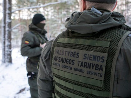 LATEZERIS, LITHUANIA - NOVEMBER 30: Lithuanian State Border Guards patrolling at the border with Belarus on November 30, 2021 in LATEZERIS, Lithuania. European Union countries accuse the Belarusian government of creating a crisis by bringing thousands of migrants - mostly from the Middle East - to the country's border with …