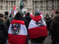 VIENNA, AUSTRIA - DECEMBER 4: People protesting against lockdown measures and Covid vaccinations march through the city center during the fourth wave of the novel coronavirus pandemic on December 4, 2021 in Vienna, Austria. Thousands of people took to the streets today to protest against lockdown measures imposed by the …