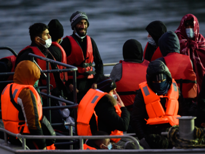 DOVER, ENGLAND - DECEMBER 16: A group of men wait to disembark from a coastguard vessel on