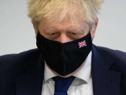 UXBRIDGE, ENGLAND - JANUARY 10: Britain's Prime Minister Boris Johnson speaks with pupils