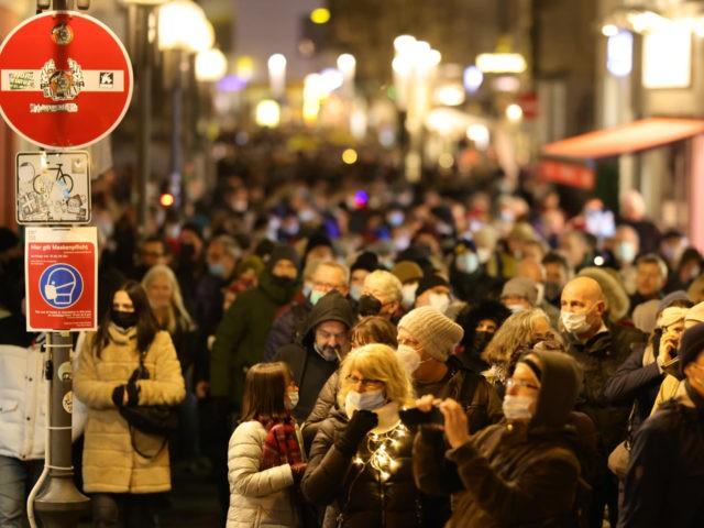 BONN, GERMANY - JANUARY 10: People protest during the weekly Monday evening stroll against