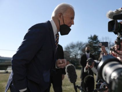WASHINGTON, DC - JANUARY 11: U.S. President Joe Biden speaks to reporters before boarding Marine One on the South Lawn of the White House on January 11, 2022 in Washington, DC. President Biden is visiting Atlanta, Georgia, along with U.S. Vice President Kamala Harris and several lawmakers to deliver remarks …