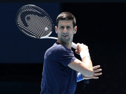 MELBOURNE, AUSTRALIA - JANUARY 12: Novak Djokovic of Serbia plays a forehand shot during a practice session ahead of the 2022 Australian Open at Melbourne Park on January 12, 2022 in Melbourne, Australia. (Photo by Darrian Traynor/Getty Images)