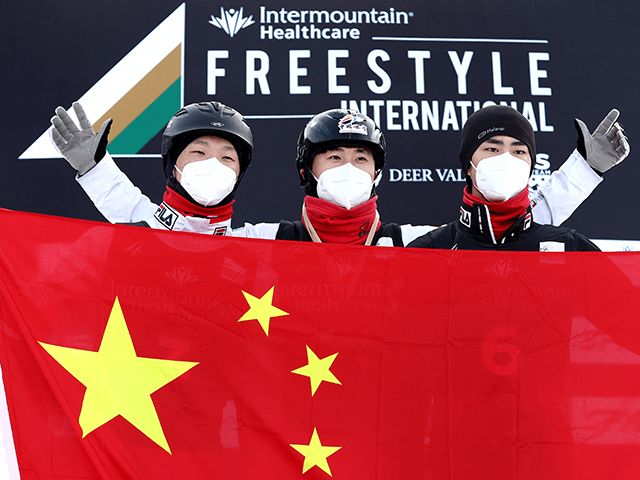 Jiaxu Sun of Team China in third place, Xindi Wang of Team China in first place, and Longxiao Yang of Team China in second place, celebrate on the podium after competing in the Men’s Aerials Final during the Intermountain Healthcare Freestyle International Ski World Cup at Deer Valley Resort on …