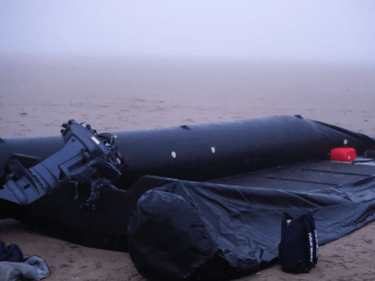 GRAVELINES, FRANCE - JANUARY 13: A burst inflatable boat on the sand in the early morning, remains of an aborted attempt to cross the English Channel by migrants after their arrest by the police on January 13, 2022 in Gravelines, near Dunkirk, France. Humanitarian association has filed manslaughter charges against …