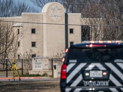 COLLEYVILLE, TEXAS - JANUARY 16: A law enforcement vehicle sits near the Congregation Beth Israel synagogue on January 16, 2022 in Colleyville, Texas. All four people who were held hostage at the Congregation Beth Israel synagogue have been safely released after more than 10 hours of being held captive by …