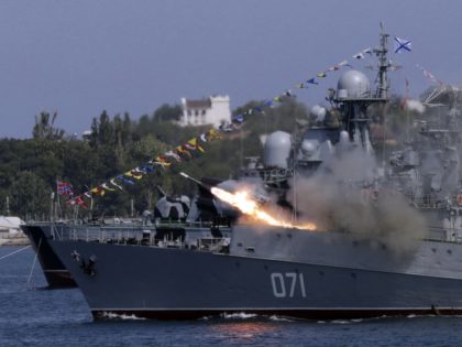 A Russian Navy ship fires missiles during Navy Day celebrations in the Crimean city of Sev