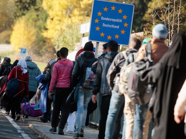 PASSAU, GERMANY - OCTOBER 28: Migrants cross border to Austria on October 28, 2015 near Wegscheid, Germany. Bavarian Governor Horst Seehofer has accused the Austrian government of wantonly shuttling migrants in buses from the Slovenian border across Austria and dumping them at all hours of day and night at the ...