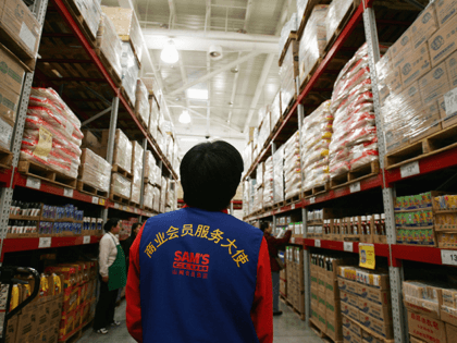 People work at Sam's club, the first branch of a Wal-Mart owned store in the capital on December 9, 2004 in Beijing, China. The world's largest retailer, Wal-Mart Stores Inc, says its inventory of stock produced in China is expected to hit U.S. $18 billion this year, keeping the annual …