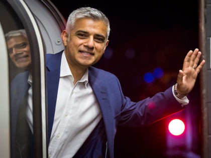 LONDON, ENGLAND - AUGUST 20: London Mayor Sadiq Khan waves from the first Night Tube train to leave from Brixton Underground Station on August 20, 2016 in London, England. The London Underground's 24-hour service begins for the first time in its 153 year history. The new Night Tube will see …