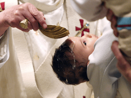 Pope Benedict XVI celebrates the baptism of thirteen children at the world famous Sistine Chapel on January 7, 2006 in Vatican City. (Photo by Alessia Giuliani/Vatican Pool-Getty Images)