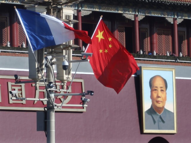 Flags of France and China flutter in front of Tiananmen Gates during French President Emmanuel Macron's visit to Beijing on January 9, 2018. Macron is due to meet with Chinese President Xi Jinping during the second day of his visit to China. / AFP PHOTO / POOL / CHARLES PLATIAU …
