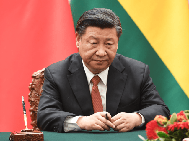 BEIJING, CHINA - JUNE 19: Chinese President Xi Jinping waits for his documents during a signing ceremony with Bolivia's President Evo Morales at the Great Hall of the People on June 19, 2018 in Beijing, China. (Photo by Greg Baker - Pool/Getty Images)