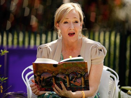 WASHINGTON - APRIL 05: British author J.K. Rowling, creator of the Harry Potter fantasy series, points to the place on her forehead where her title character has a scar while reading "Harry Potter and the Sorcerer's Stone" during the Easter Egg Roll on the South Lawn of the White House …