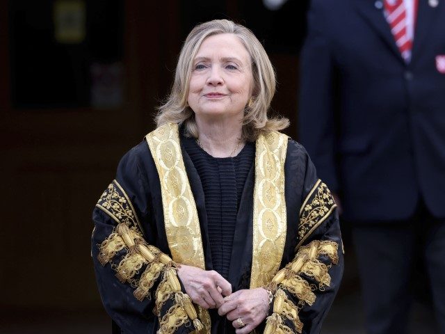Former US Secretary of State Hillary Clinton poses for a photo after being inaugarated as