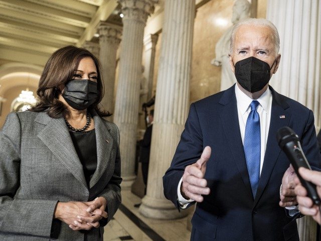 President Joe Biden speaks to reporters as he departs with Vice President Kamala Harris through the Hall of Columns after he spoke in Statuary Hall at the U.S. Capitol to mark the one-year anniversary of the Jan. 6 riot at the Capitol by supporters loyal to then-President Donald Trump, Thursday, …